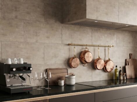 concrete look porcelain tile backsplash with black countertops