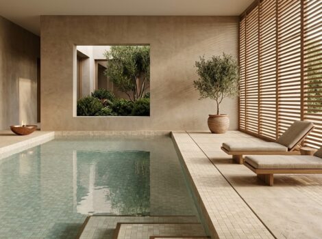 Luxury indoor pool area in Anaheim featuring Ivory Honed 1x1 Travertine Mosaic tile.