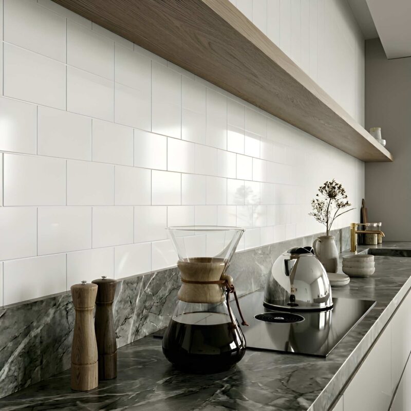 A modern luxury kitchen in Fairfax featuring a bright white honed marble subway tile backsplash.